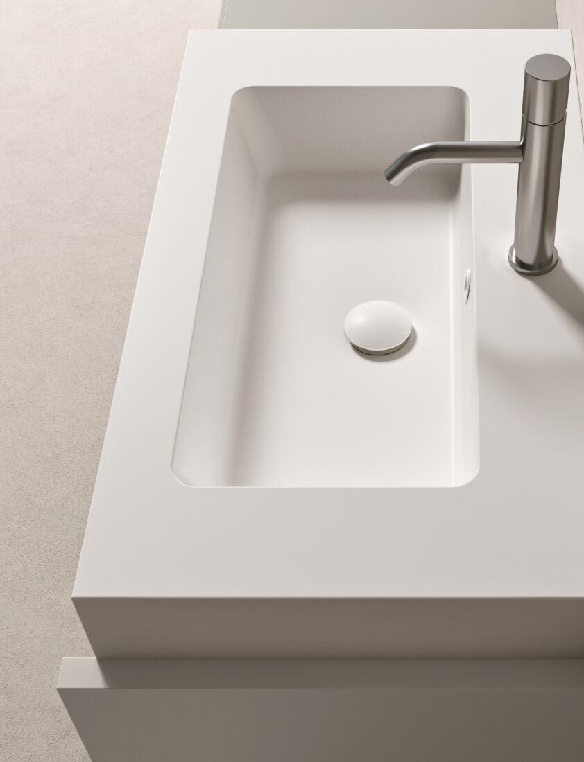 Lavabo bianco con rubinetto in acciaio inossidabile, design minimalista e pulito.