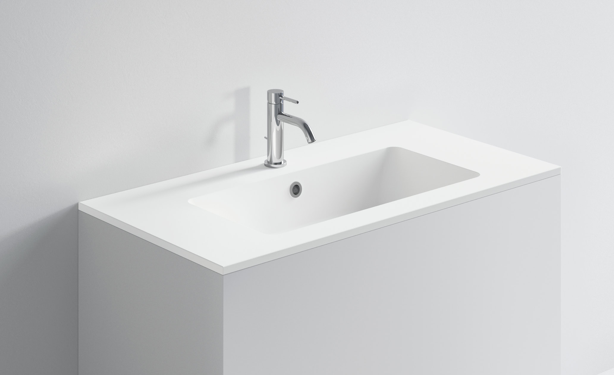 Lavabo bianco moderno con rubinetto in acciaio inox.