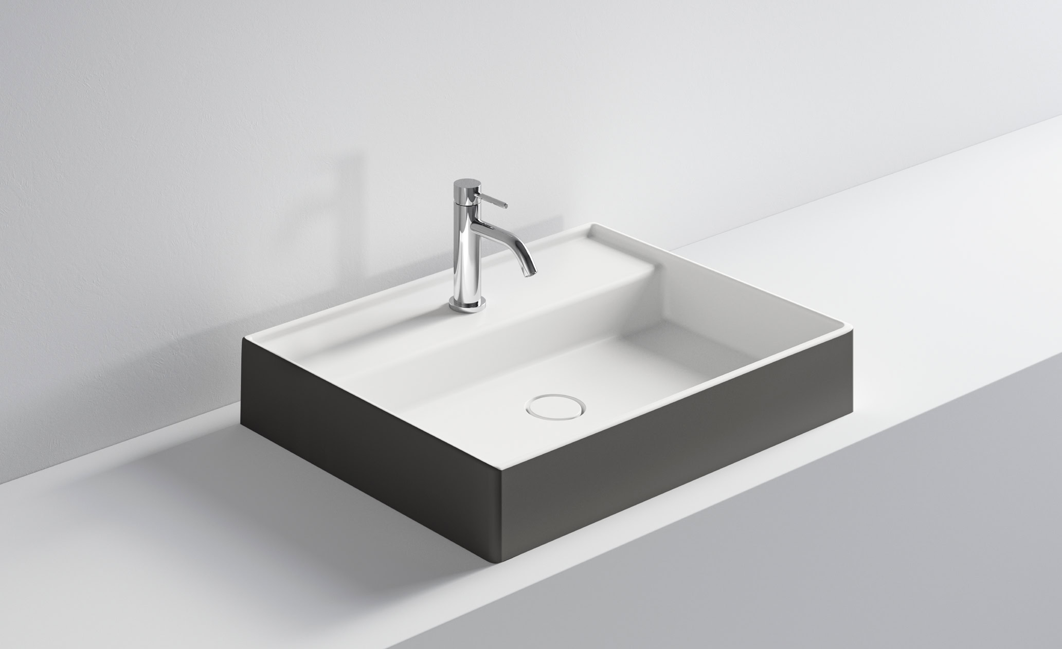 Lavabo rettangolare con rubinetto in acciaio inox, stile contemporaneo.