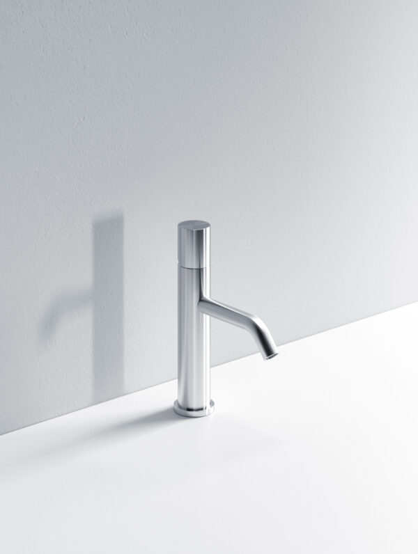 Sleek chrome kitchen faucet mounted on a white countertop.