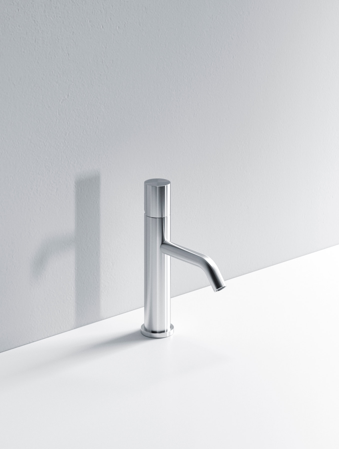 Sleek chrome kitchen faucet mounted on a white countertop.