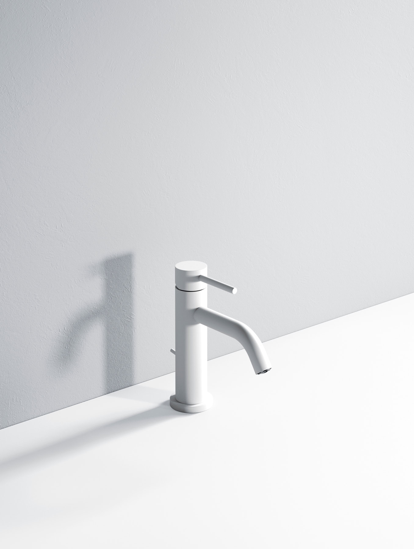 Rubinetto da cucina bianco minimalista su parete grigia.