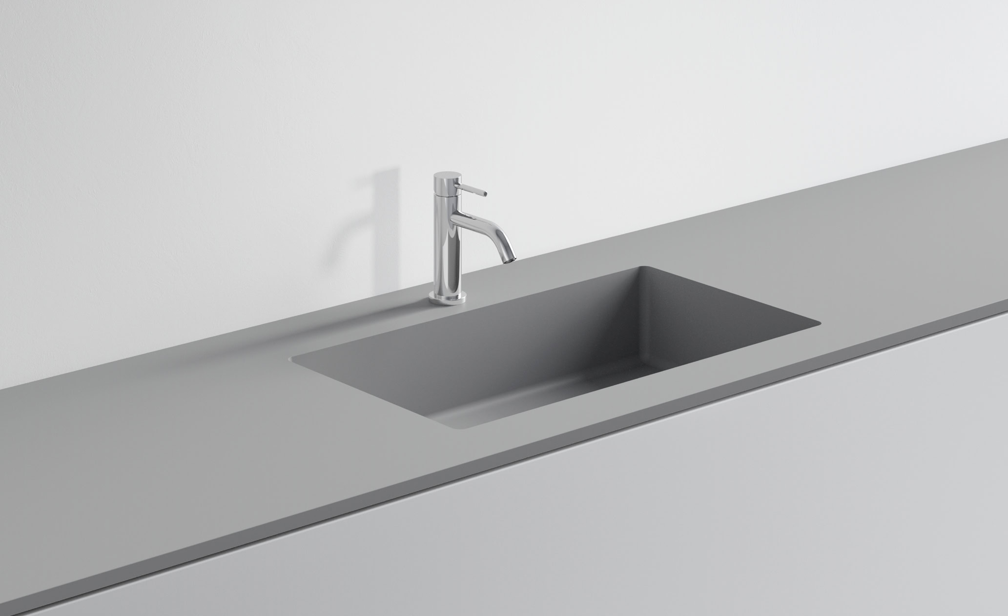Lavandino in acciaio inox con rubinetto in cucina moderna.