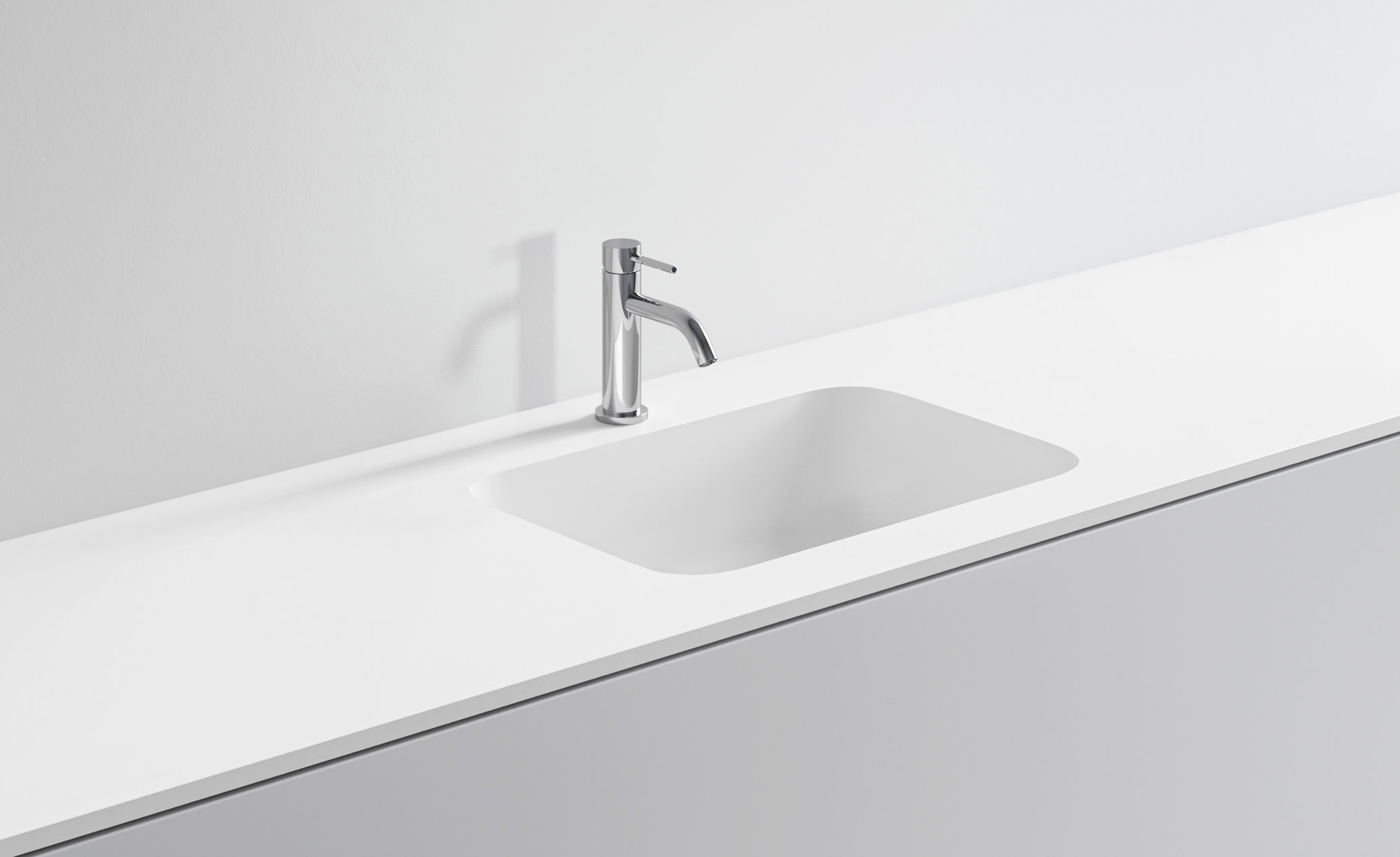 Lavandino bianco con rubinetto in acciaio inox in cucina moderna.
