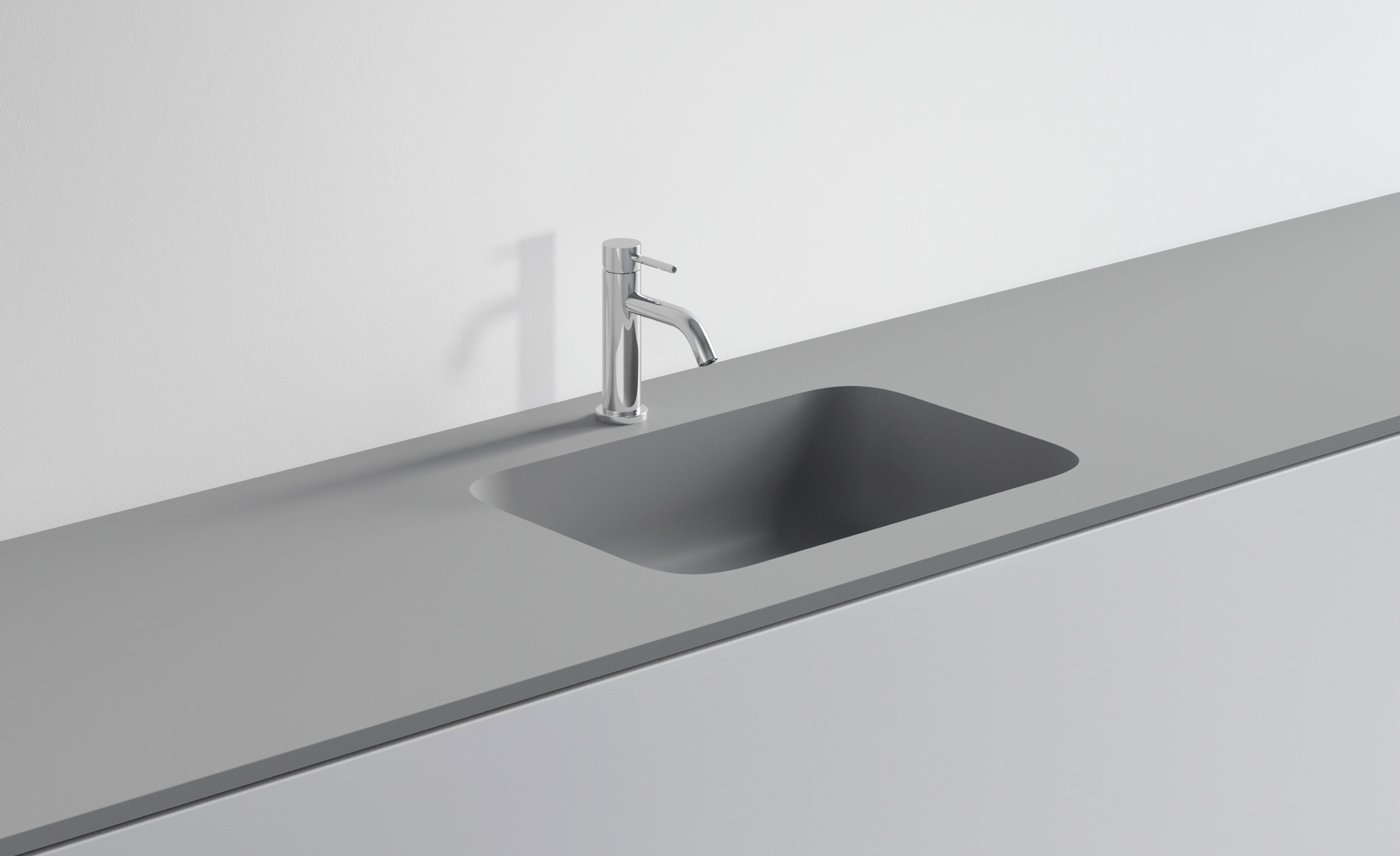 Lavandino in acciaio inox con rubinetto in cucina minimalista.