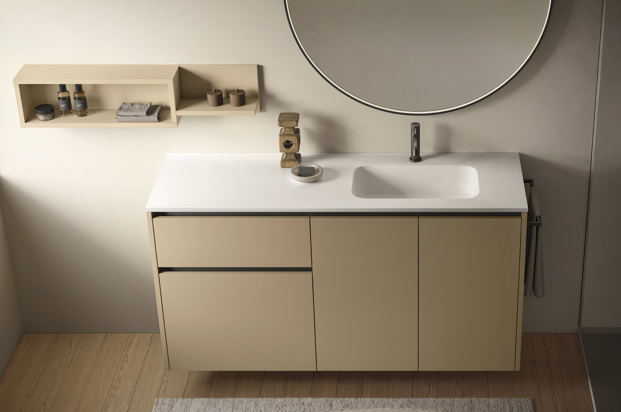 Mobile bagno con lavabo integrato e specchio rotondo.