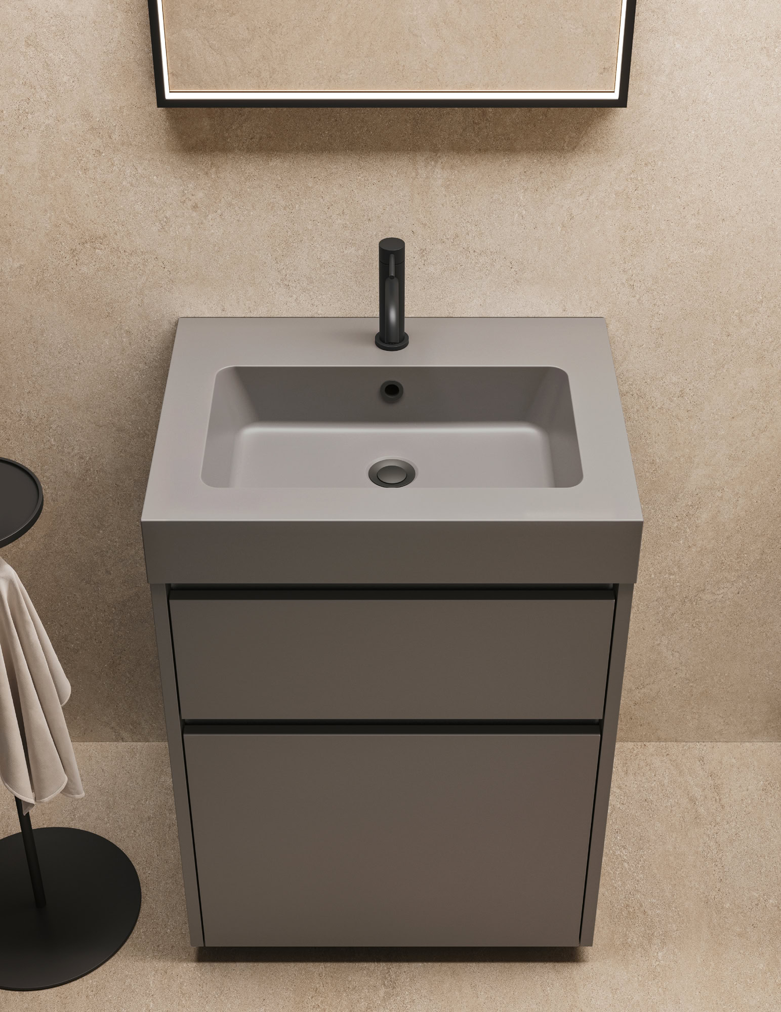 Lavabo con mobile grigio e rubinetto nero in bagno minimalista.