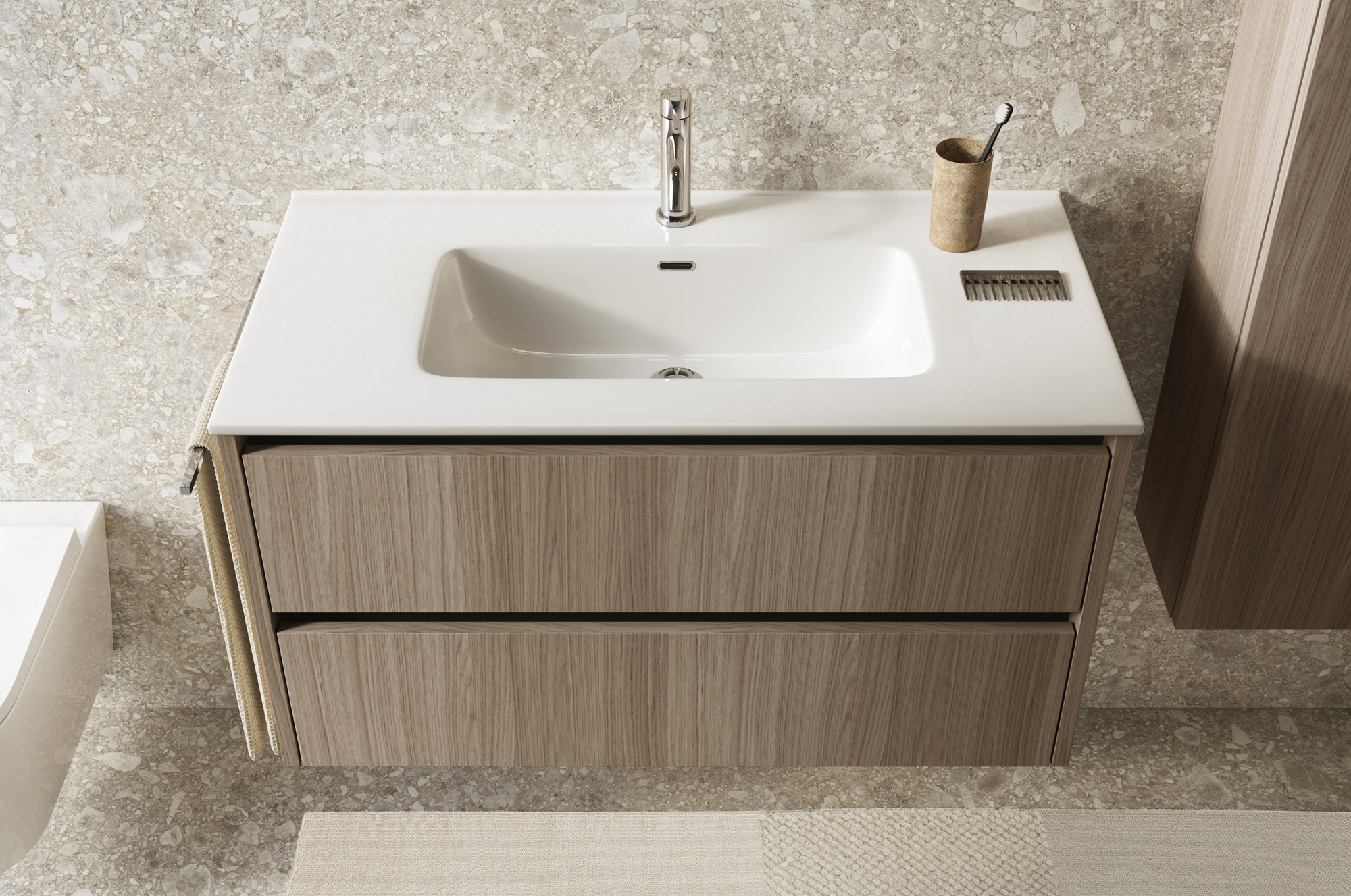Mobile bagno con lavabo integrato e accessori in stile minimalista.