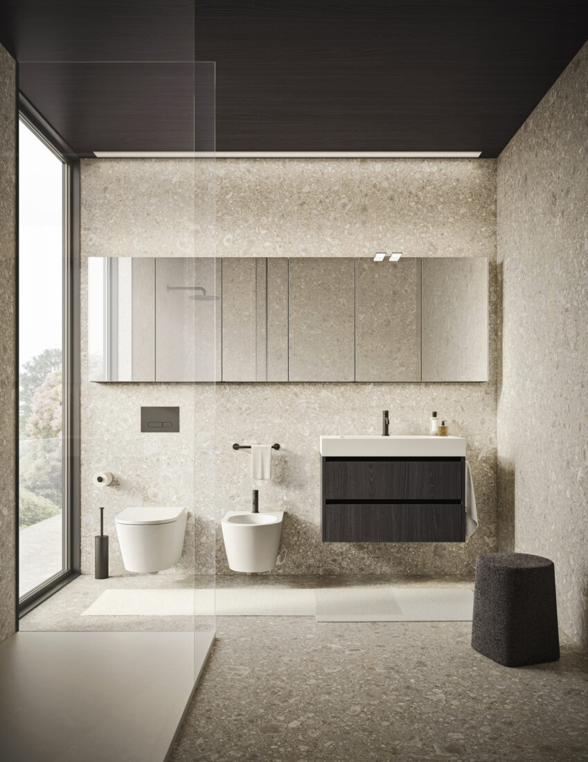 Bagno elegante con lavabo, bidet e specchio grande, design minimalista e luminoso.