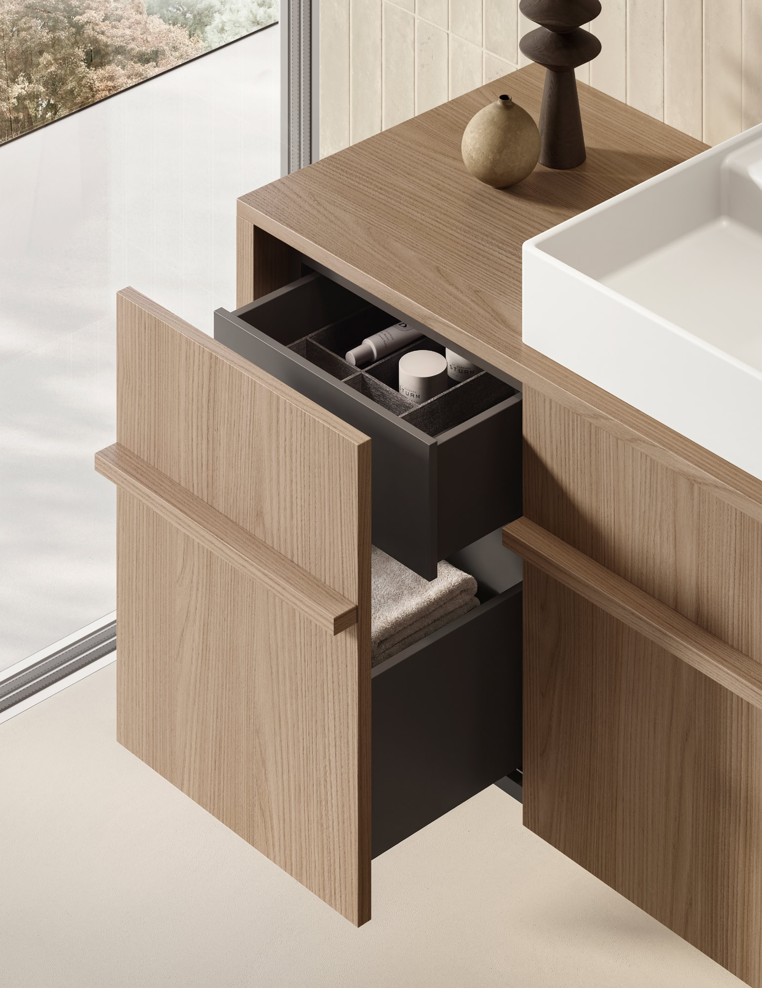 Contemporary bathroom vanity with open drawers and a white sink.
