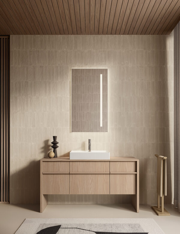 Bagno minimalista con lavabo rettangolare e specchio illuminato.