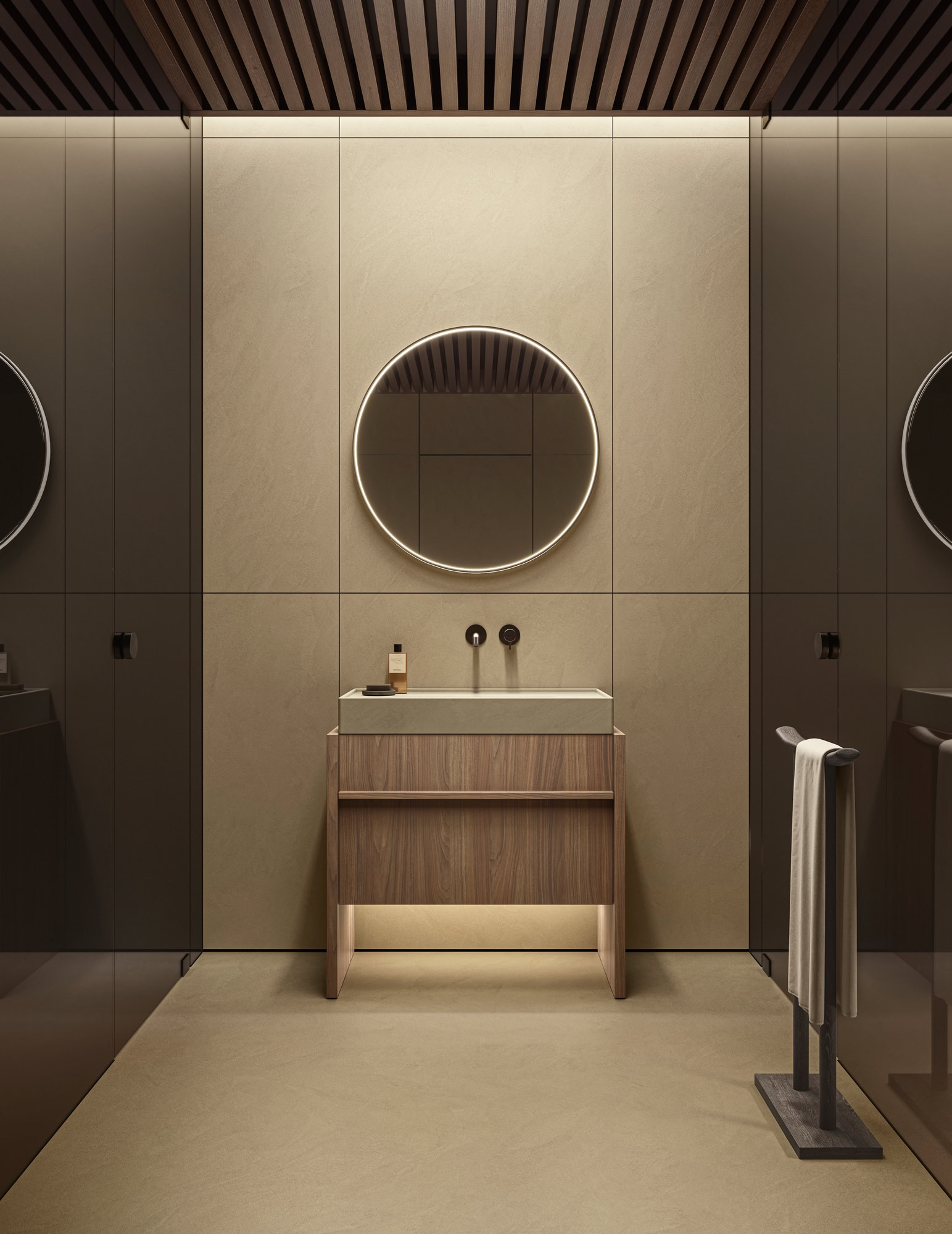 Contemporary bathroom with round illuminated mirror and wooden vanity.