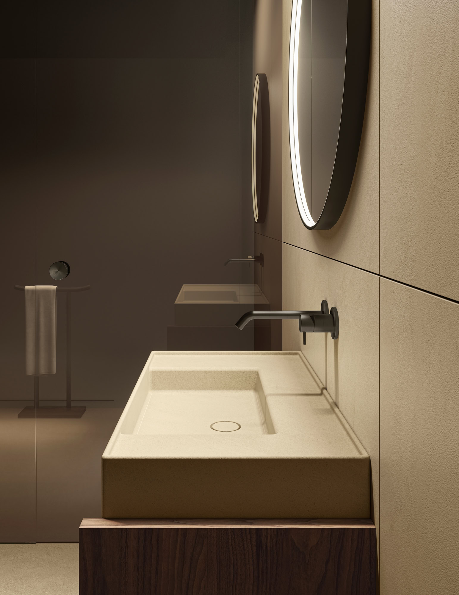 Contemporary bathroom with beige sink, round mirror, and sleek fixtures.