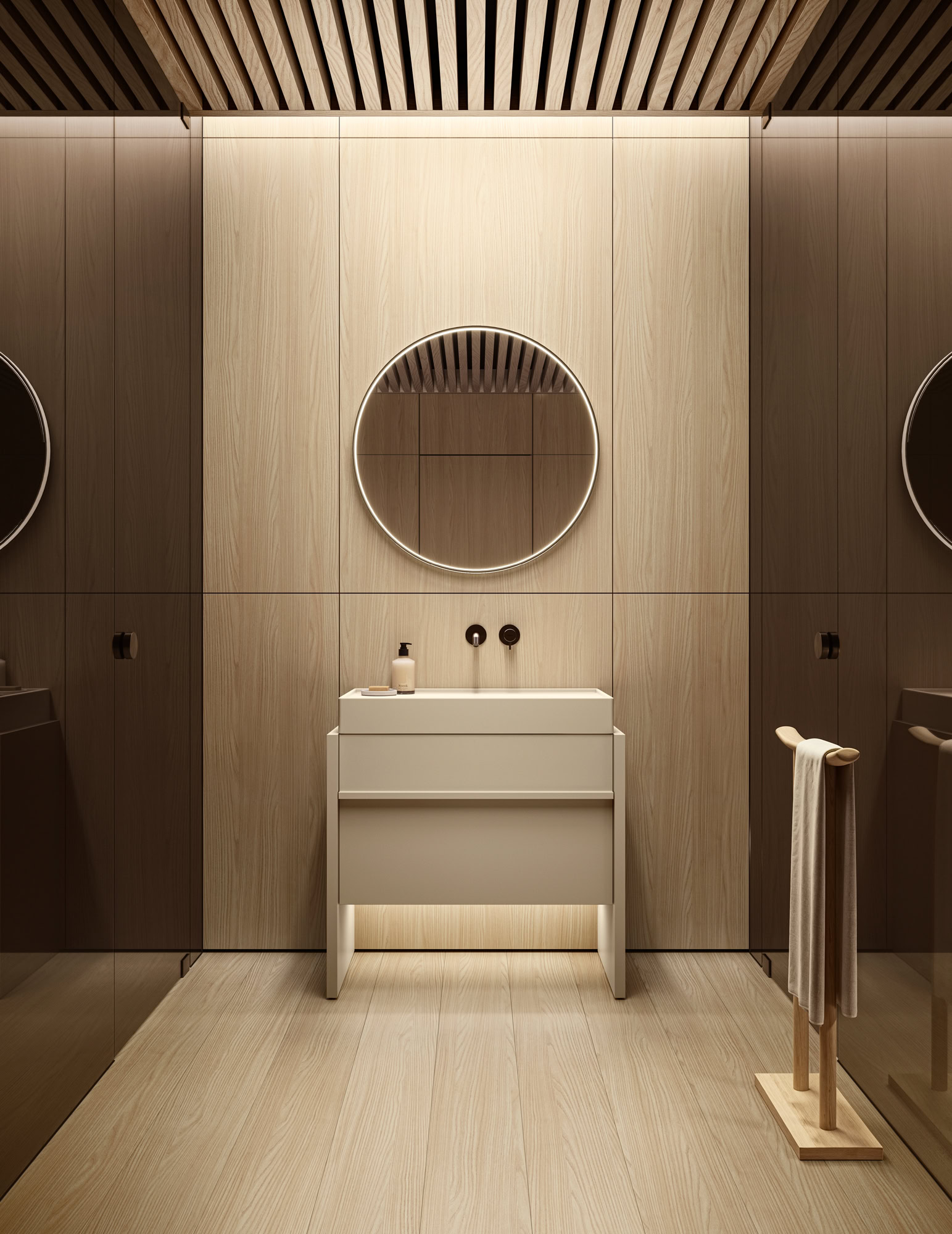 Minimalist bathroom with round mirror, white sink, and wooden accents.
