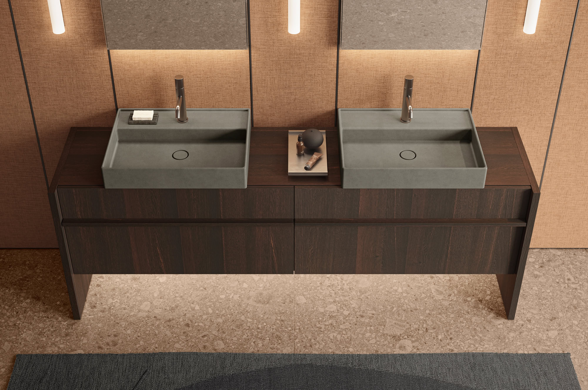 Contemporary double bathroom vanity with two gray sinks and wooden cabinet.