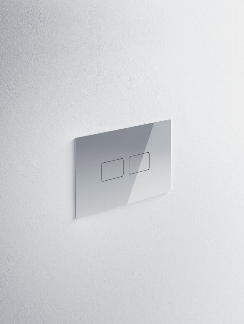 Pulsante di comando per WC con design minimalista e superficie lucida.