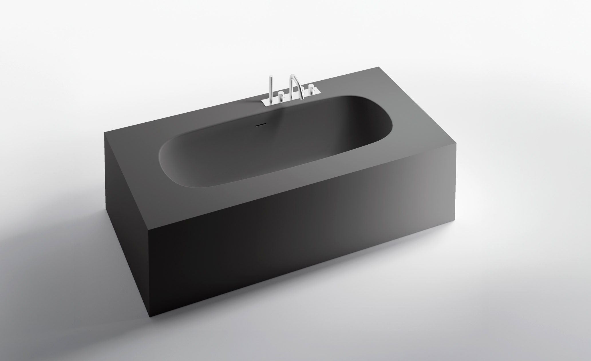 Vasca da bagno rettangolare in pietra con rubinetto integrato.