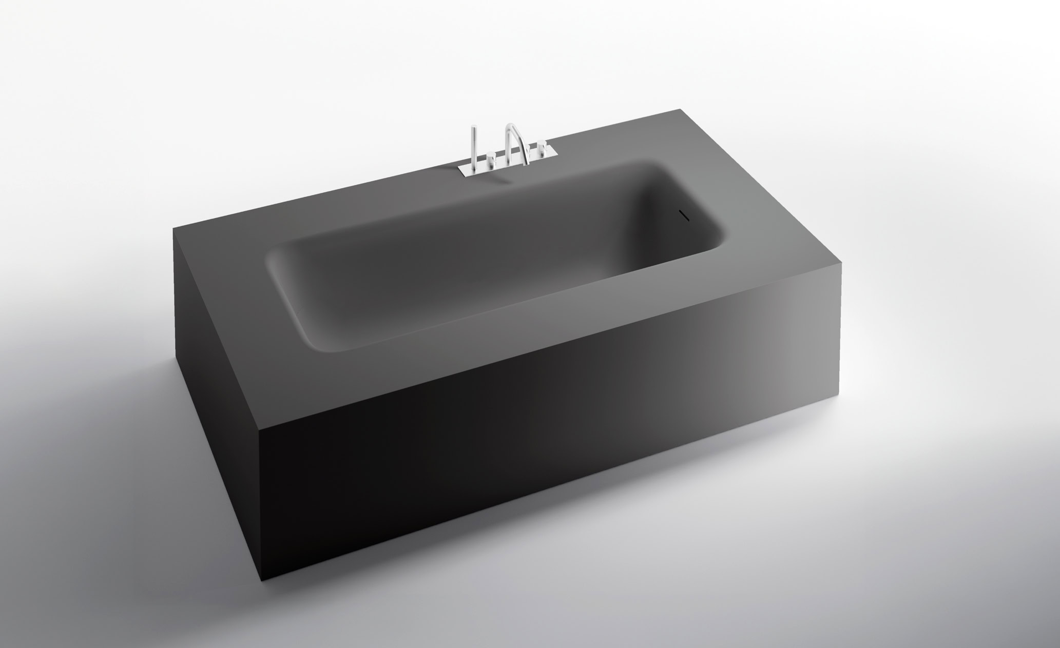 Vasca da bagno rettangolare in pietra con rubinetto integrato.