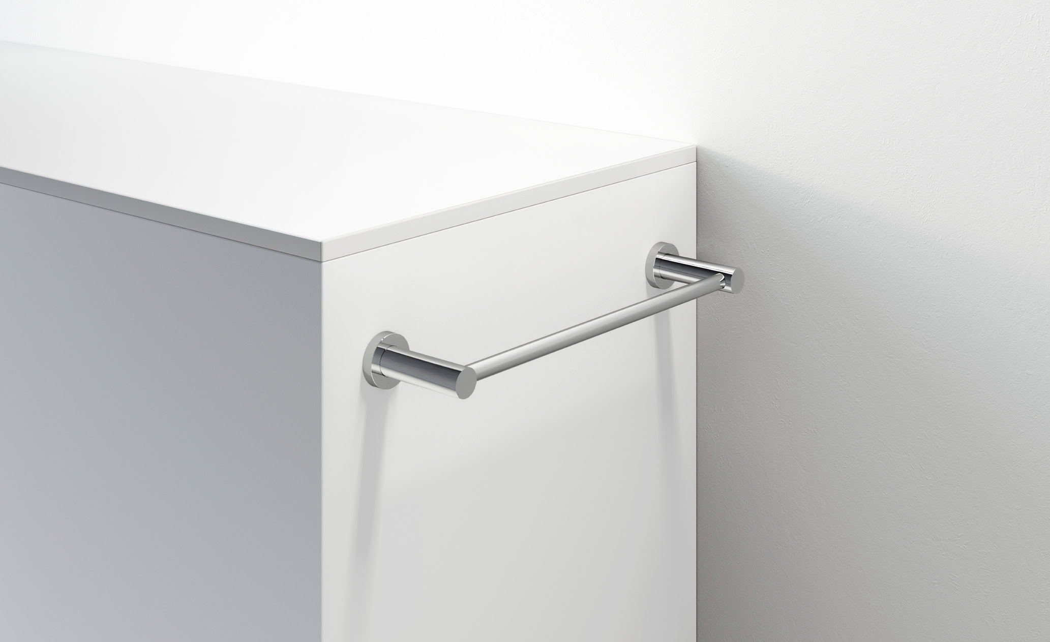 Porta asciugamano in acciaio inox su mobile bianco moderno.