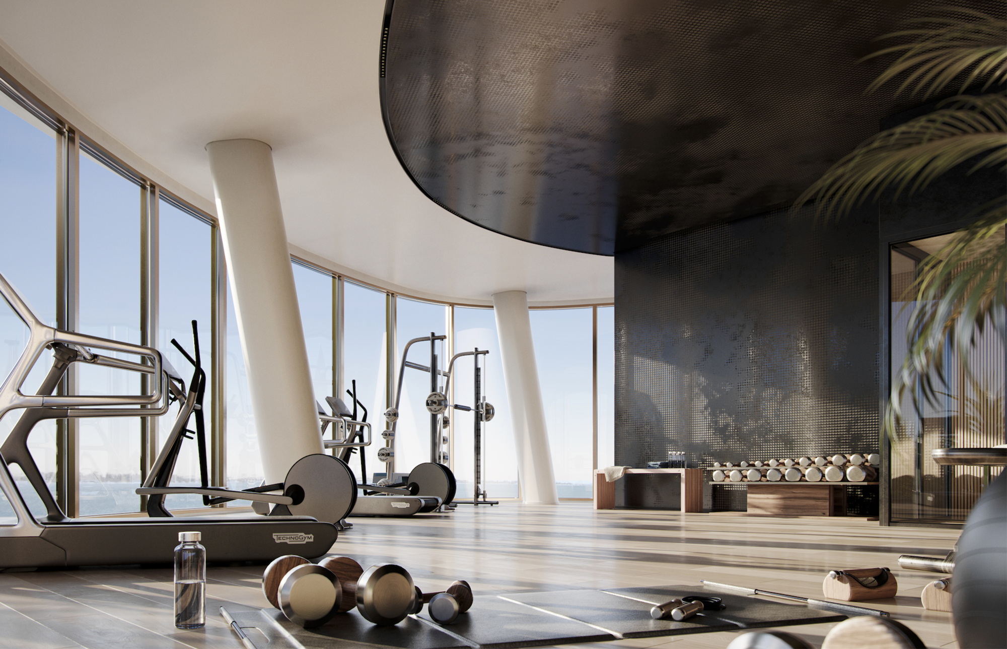 Area fitness lounge in modern gym with large windows and equipment.